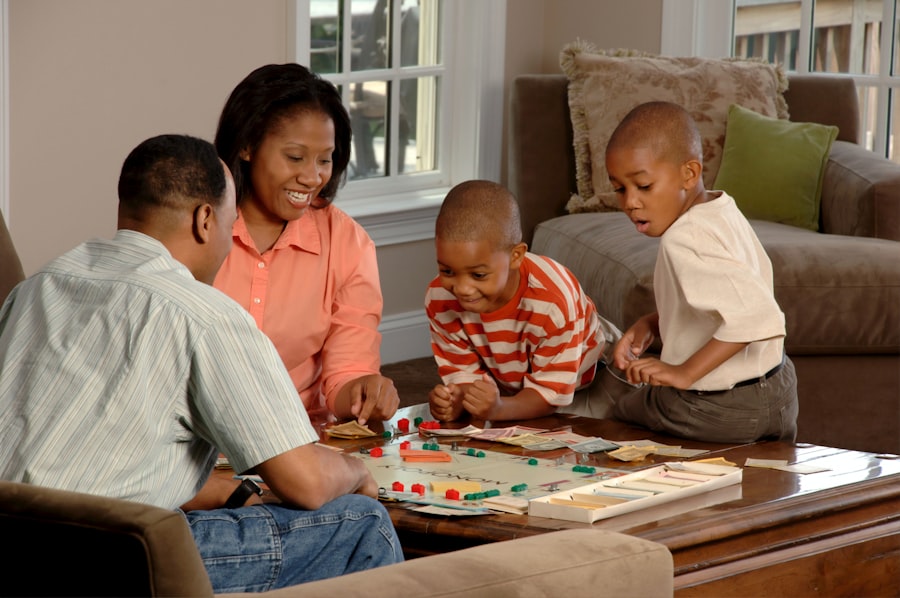 A family laughing together over a board game in their living room